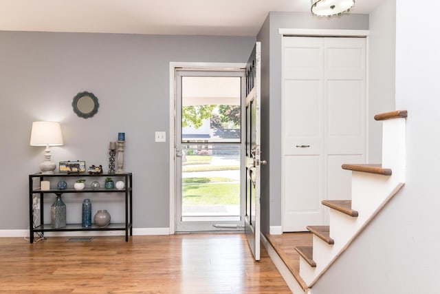 680 Eastlook Dr, Saline, MI 48176 - entrance foyer featuring light wood-type flooring and stairs