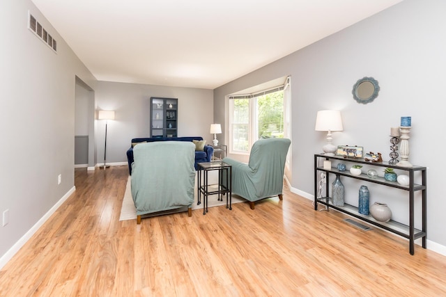 680 Eastlook Dr, Saline, MI 48176 - living area featuring wood finished floors and baseboards