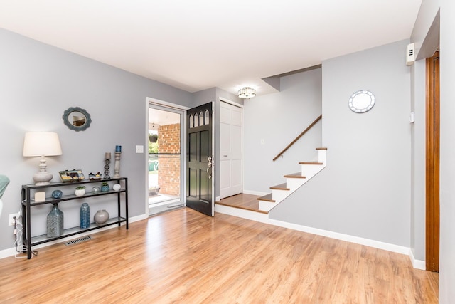 680 Eastlook Dr, Saline, MI 48176 - entryway featuring light wood-type flooring and stairs