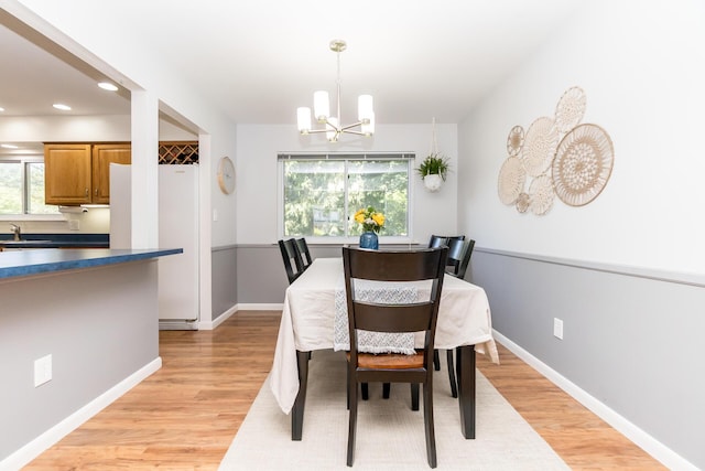 680 Eastlook Dr, Saline, MI 48176 - dining area featuring a chandelier, light wood-style floors, and recessed lighting
