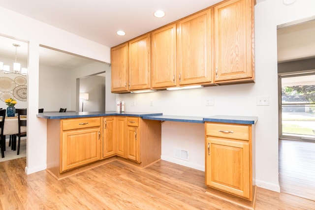 680 Eastlook Dr, Saline, MI 48176 - kitchen with light wood-type flooring, dark countertops, recessed lighting, a chandelier, and light brown cabinetry