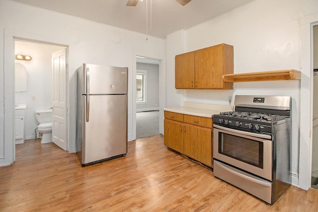 916 Osborne St, Kalamazoo, MI 49001 - kitchen featuring appliances with stainless steel finishes, light wood-style floors, and light countertops