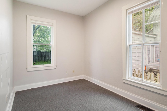 916 Osborne St, Kalamazoo, MI 49001 - spare room featuring dark colored carpet and baseboards