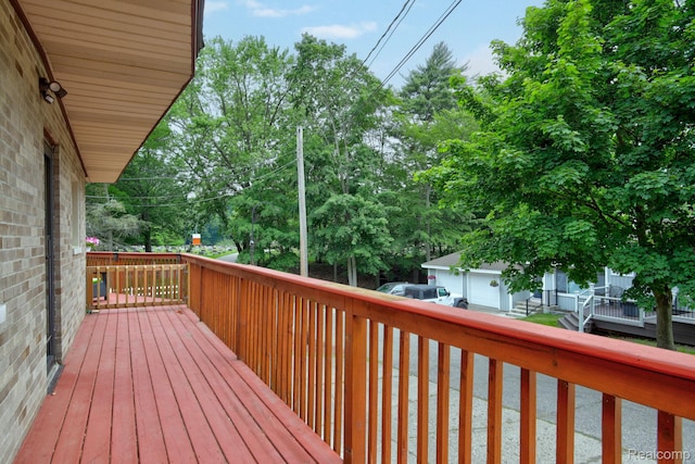 199 Grand Ave, Grand Haven, MI 49417 - wooden terrace featuring an outbuilding and view of scattered trees