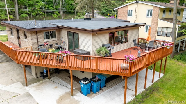 199 Grand Ave, Grand Haven, MI 49417 - rear view of house with a wooden deck and outdoor dining space