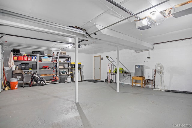 199 Grand Ave, Grand Haven, MI 49417 - garage with a garage door opener and concrete block wall