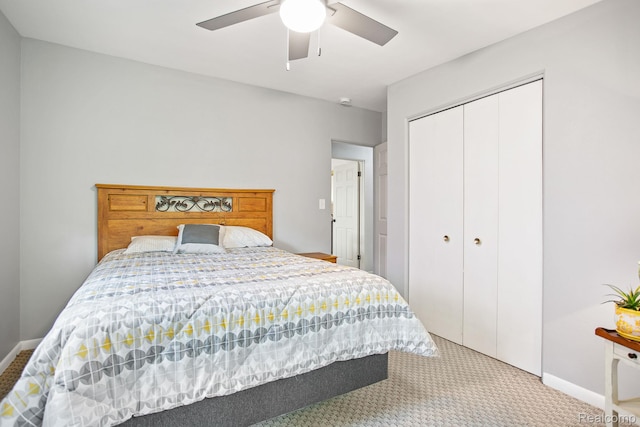 199 Grand Ave, Grand Haven, MI 49417 - bedroom with light colored carpet, a closet, and ceiling fan