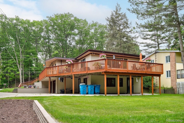 199 Grand Ave, Grand Haven, MI 49417 - rear view of property featuring a deck, a yard, a patio area, and driveway