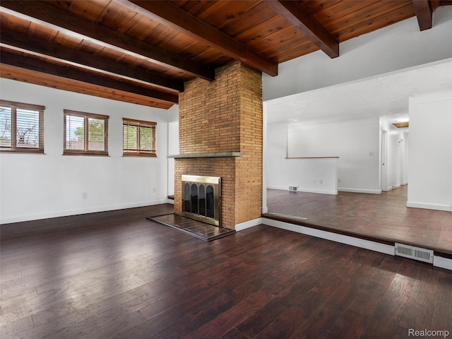 23400 Marlow St, Oak Park, MI 48237 - unfurnished living room featuring a wood ceiling with exposed beams, hardwood / wood-style floors, and a brick fireplace
