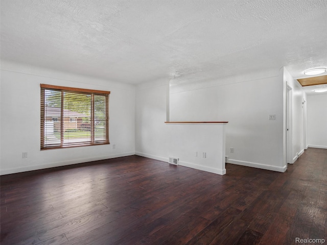 23400 Marlow St, Oak Park, MI 48237 - spare room with a textured ceiling and dark wood-style flooring
