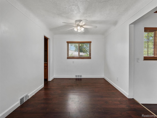 23400 Marlow St, Oak Park, MI 48237 - spare room with a ceiling fan, plenty of natural light, wood finished floors, and a textured ceiling
