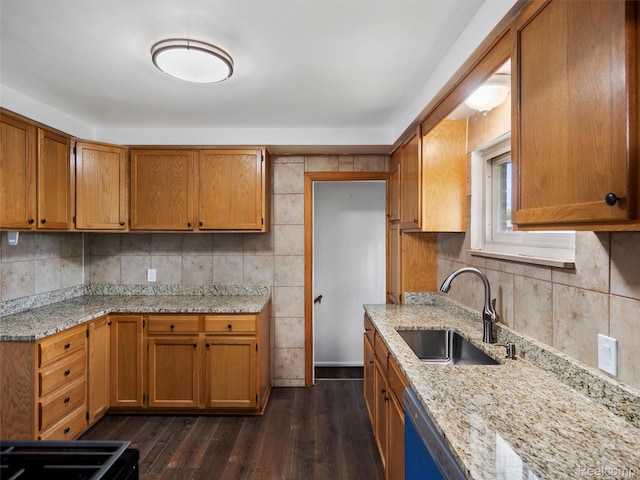 23400 Marlow St, Oak Park, MI 48237 - kitchen with brown cabinetry, backsplash, dark wood-style flooring, and light stone countertops