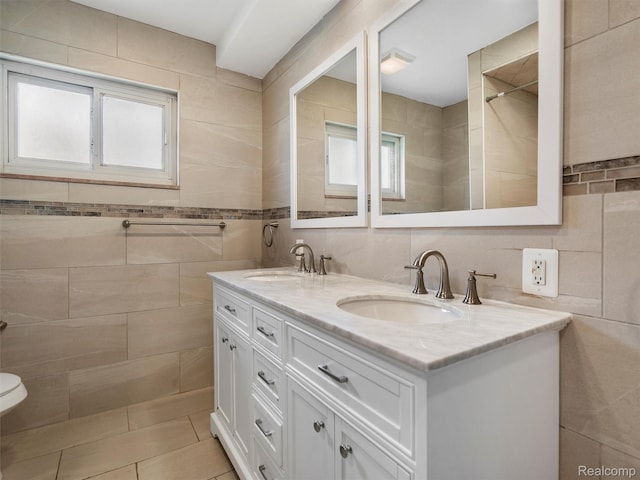 23400 Marlow St, Oak Park, MI 48237 - bathroom featuring tile walls, double vanity, and tile patterned flooring