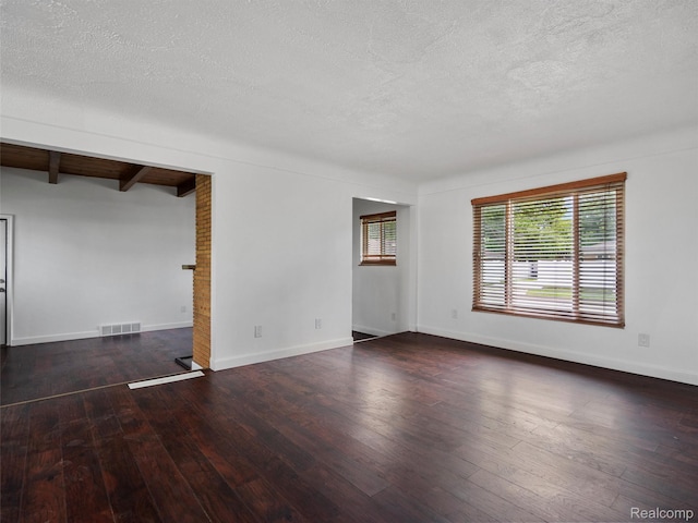 23400 Marlow St, Oak Park, MI 48237 - empty room with a textured ceiling, hardwood / wood-style flooring, and beam ceiling