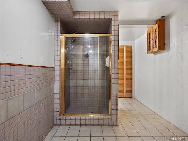 23400 Marlow St, Oak Park, MI 48237 - full bath featuring a stall shower, tile patterned floors, and tile walls