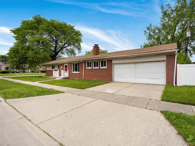 23400 Marlow St, Oak Park, MI 48237 - single story home with brick siding, an attached garage, driveway, and a chimney