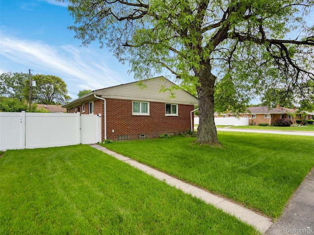 23400 Marlow St, Oak Park, MI 48237 - view of home's exterior with brick siding, a gate, and crawl space