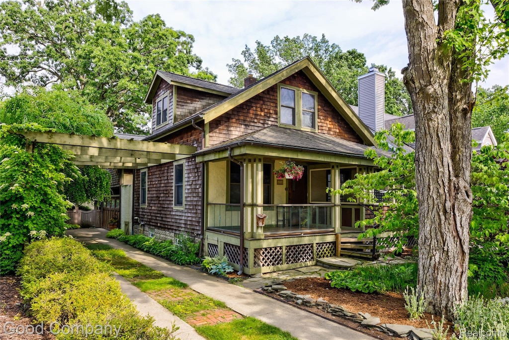 2812 Robina Ave, Berkley, MI 48072 - view of front of property featuring a chimney, a porch, and a shingled roof