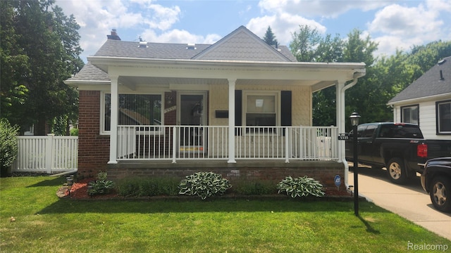 3335 Linden St, Dearborn, MI 48124 - view of front of home featuring a porch and a chimney