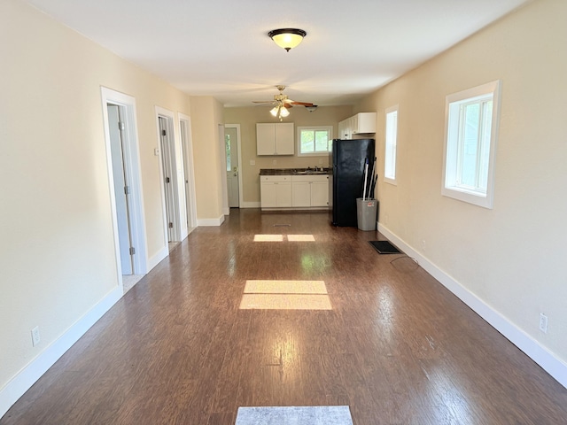 234 Broad St, Michigan Center, MI 49254 - unfurnished living room with a ceiling fan and dark wood finished floors