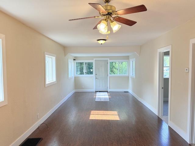 234 Broad St, Michigan Center, MI 49254 - spare room featuring dark wood-style flooring and a ceiling fan