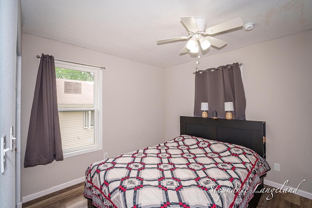 348 Yuba St, Muskegon, MI 49442 - bedroom with wood finished floors and ceiling fan