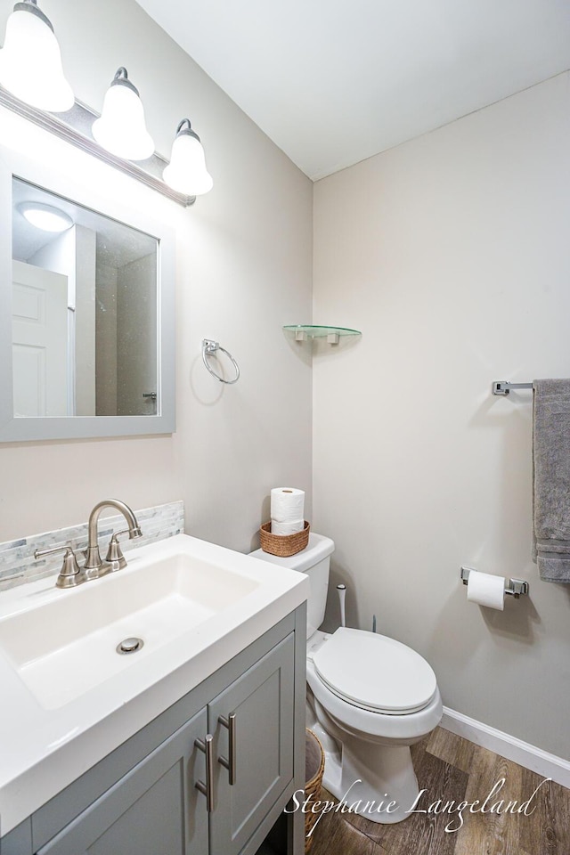 348 Yuba St, Muskegon, MI 49442 - bathroom with wood finished floors and vanity