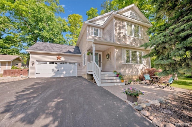 737 Camilla Blvd, Lake Orion, MI 48362 - view of front facade with asphalt driveway and an attached garage