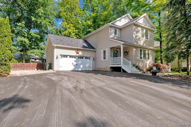 737 Camilla Blvd, Lake Orion, MI 48362 - view of front of home featuring an attached garage and asphalt driveway