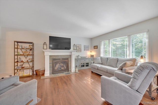 737 Camilla Blvd, Lake Orion, MI 48362 - living area with a tiled fireplace and wood finished floors