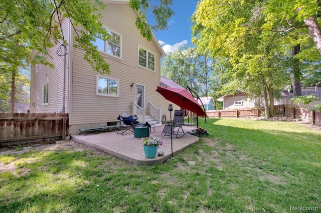737 Camilla Blvd, Lake Orion, MI 48362 - rear view of property featuring entry steps, a fenced backyard, and a patio