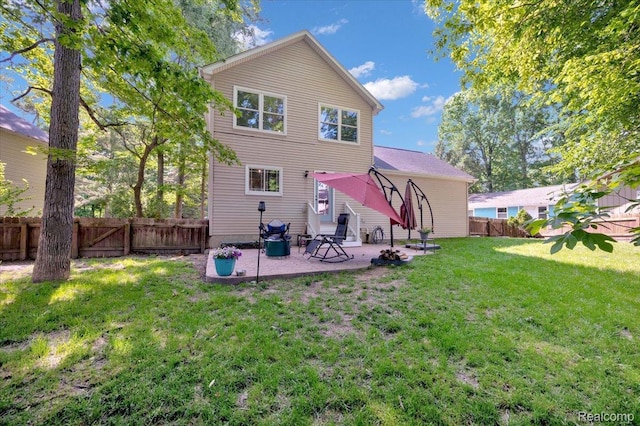 737 Camilla Blvd, Lake Orion, MI 48362 - back of property featuring a fenced backyard and a patio