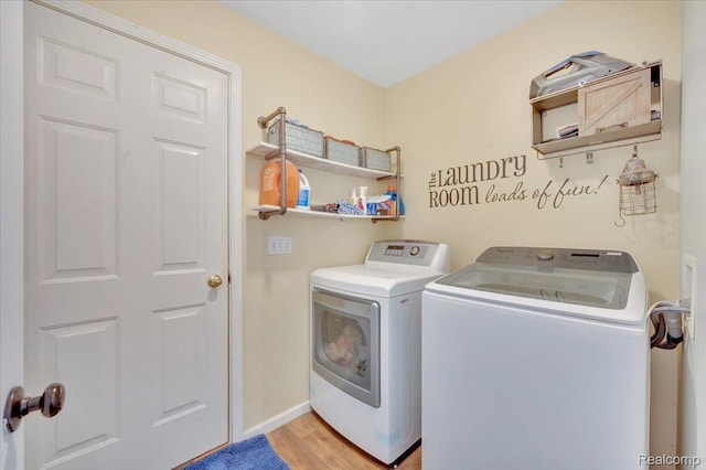 737 Camilla Blvd, Lake Orion, MI 48362 - laundry area with separate washer and dryer and light wood-style flooring
