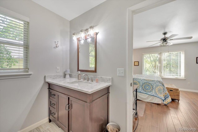 737 Camilla Blvd, Lake Orion, MI 48362 - bathroom with vanity, wood finished floors, and ceiling fan