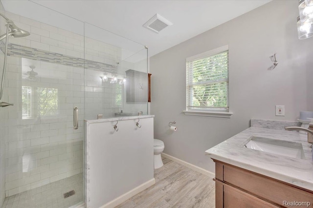 737 Camilla Blvd, Lake Orion, MI 48362 - bathroom with vanity, wood finished floors, and a stall shower
