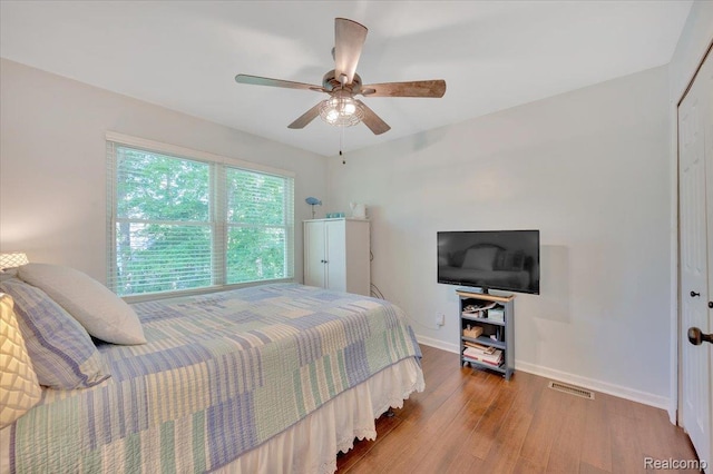737 Camilla Blvd, Lake Orion, MI 48362 - bedroom with wood finished floors, ceiling fan, and a closet