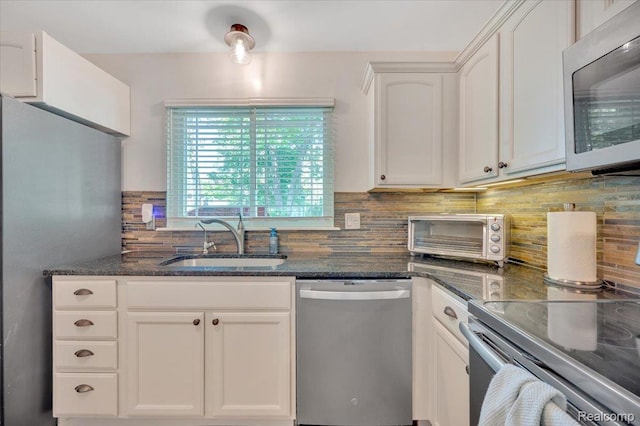 737 Camilla Blvd, Lake Orion, MI 48362 - kitchen with appliances with stainless steel finishes, backsplash, white cabinets, and dark stone counters