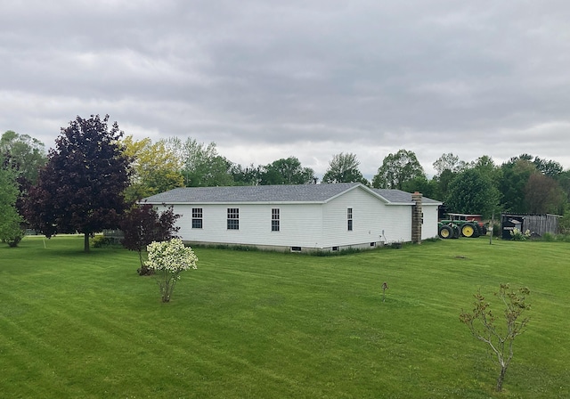 7560 W Washington Rd, Sumner, MI 48889 - view of home's exterior with a yard