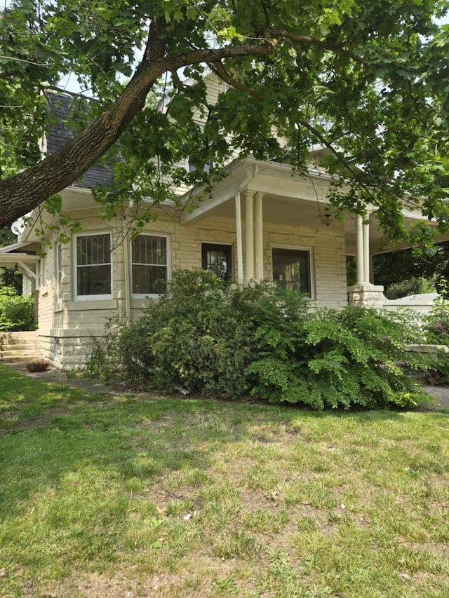 1111 E Michigan Ave, Albion, MI 49224 - view of side of property with a lawn