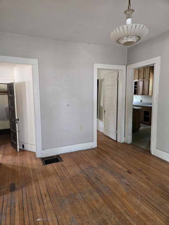 1111 E Michigan Ave, Albion, MI 49224 - empty room featuring hardwood / wood-style floors