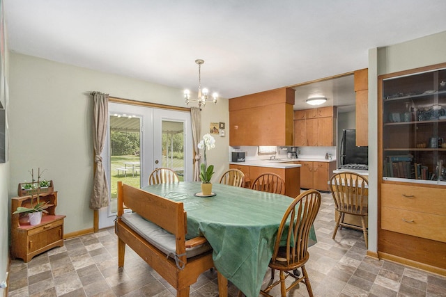 6361 Plainfield Ave, Kalamazoo, MI 49048 - dining space featuring a chandelier and french doors