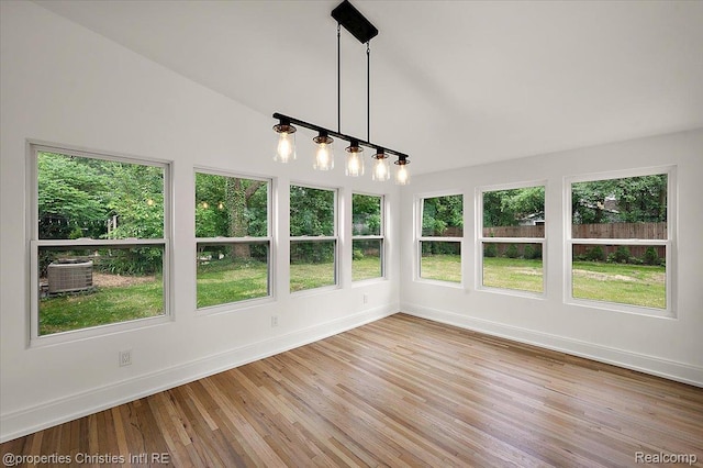 15589 Kirkshire Ave, Beverly Hills, MI 48025 - unfurnished sunroom with plenty of natural light, wood finished floors, and lofted ceiling