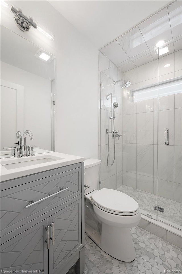 15589 Kirkshire Ave, Beverly Hills, MI 48025 - full bathroom featuring a stall shower, vanity, and tile patterned flooring