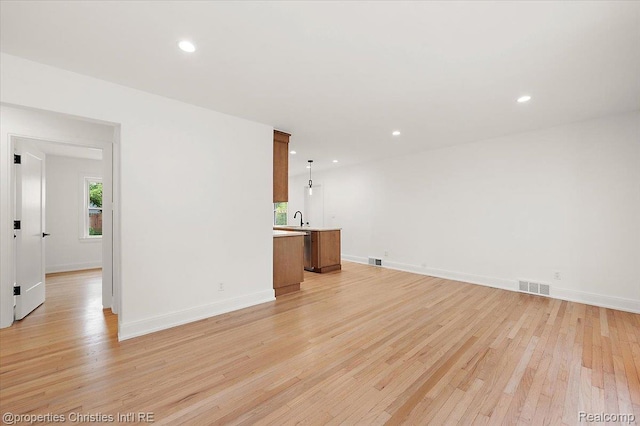 15589 Kirkshire Ave, Beverly Hills, MI 48025 - unfurnished living room with light wood-style floors and recessed lighting