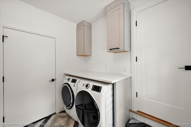 15589 Kirkshire Ave, Beverly Hills, MI 48025 - laundry room featuring cabinet space, washing machine and clothes dryer, and light marble finish floors
