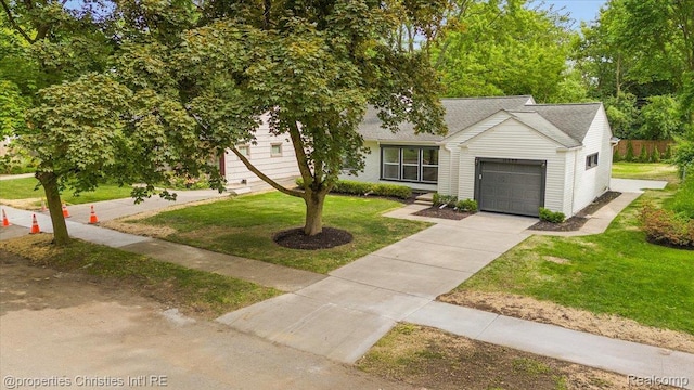 15589 Kirkshire Ave, Beverly Hills, MI 48025 - view of front of property featuring a garage, a front lawn, a shingled roof, and concrete driveway