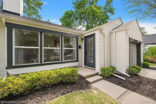 15589 Kirkshire Ave, Beverly Hills, MI 48025 - view of exterior entry featuring a garage