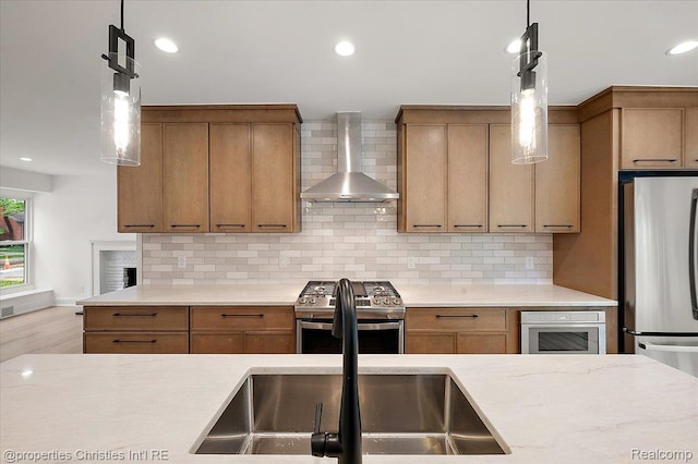 15589 Kirkshire Ave, Beverly Hills, MI 48025 - kitchen with wall chimney range hood, stainless steel appliances, light countertops, decorative light fixtures, and recessed lighting