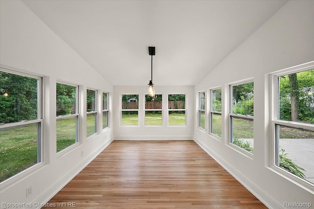 15589 Kirkshire Ave, Beverly Hills, MI 48025 - unfurnished sunroom with vaulted ceiling, plenty of natural light, and wood finished floors