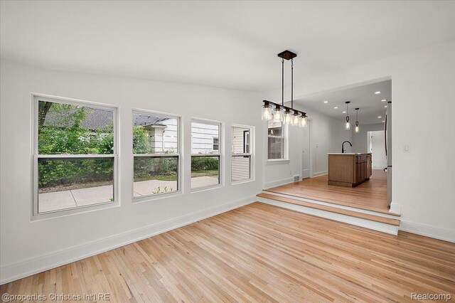 15589 Kirkshire Ave, Beverly Hills, MI 48025 - unfurnished dining area with light wood-style floors and baseboards